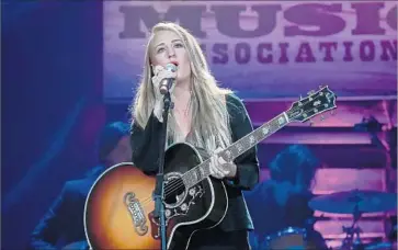  ?? Rick Diamond Getty Images ?? MARGO PRICE said fellow country musicians must use their inf luence to speak out for tighter gun control.