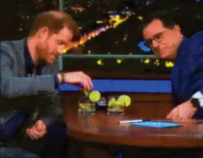  ?? ?? Salty: Harry does a tequila shot with US host Stephen Colbert