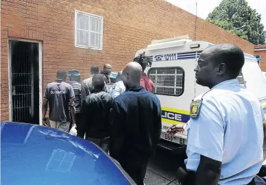  ?? / THULANI MBELE ?? Eight suspected criminals, including a police officer, appeared in the Fochville Magistrate’s Court yesterday on charges of illegally dealing in explosives.