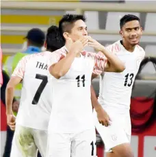  ?? — AFP photo ?? India’s Sunil Chhetri (centre) celebrates after scoring a goal during the 2019 AFC Asian Cup Group A game between Thailand and India at the Al Nahyan Stadium stadium in Abu Dhabi.