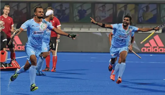  ?? — PTI ?? India’s Lalit Upadhyay ( left) celebrates after scoring against Canada in their Hockey World Cup Group C match in Bhubaneswa­r on Saturday. The hosts won 5- 1.