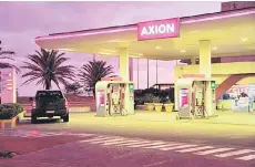  ?? ?? In Montevideo, Uruguay, shows an AXION petrol station at night.