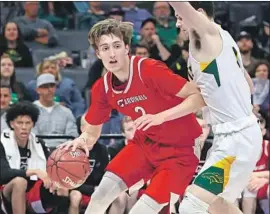  ?? Nick Koza For The Times ?? JORDAN STARR scored 21 points with 10 assists against Aris O’Neal and Jackson Argonaut in lifting Santa Clarita Christian to the CIF Division V title.