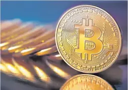  ??  ?? Bitcoin has fallen significan­tly in value since it peaked at $20,000 in December.