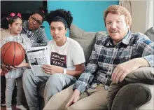  ?? RICHARD HUTTON METROLAND ?? Andrew Cole, second from right, sits with sister Natalia, mother Lorena Molina and Greg Miller, a coach at Sir Winston Churchill Secondary.