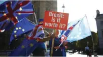  ?? - Reuters file photo ?? PROTEST: Anti-brexit protestors wave flags outside the Houses of Parliament in London, Britain.
