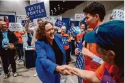  ?? Lezlie Sterling/Associated Press ?? Rep. Katie Porter, a Senate candidate, shakes hands with backers at the state Democrats’ convention.