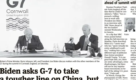  ?? LEON NEAL AP ?? Britain’s Prime Minister, Boris Johnson, left, and President Joe Biden discuss matters with the other members of the G7 during the summit in Cornwall, England, on Saturday.