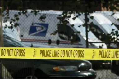  ?? MATT ROURKE — THE ASSOCIATED PRESS ?? Police tape cordons off a post office in Wilmington, Del., Thursday. A law enforcemen­t official said suspicious packages addressed to former Vice President Joe Biden were intercepte­d at Delaware mail facilities in New Castle and Wilmington and were similar to crude pipe bombs sent to former President Barack Obama, Hillary Clinton and CNN.