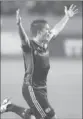  ?? Joe Scarnici Getty Images ?? KELYN ROWE of New England scored in the 10th minute of a soggy win over the Galaxy.