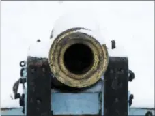  ??  ?? Looking down the barrel of a snow-covered cannon on display at Valley Forge National Historical Park in Valley Forge.