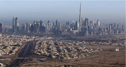  ??  ?? BURJ KHALIFA, the world’s tallest tower, is seen in a general view of Dubai, UAE. Next stop Mars? (Karim Sahib/Reuters)