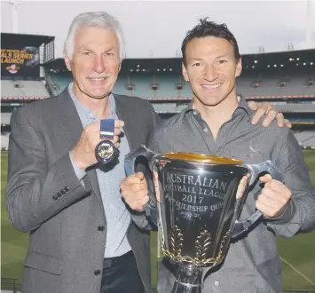  ?? Picture: GETTY IMAGES ?? Coaching legend Michael Malthouse and games record-holder Brent Harvey will present the Jock McHale Medal and Premiershi­p Cup on grand final day.