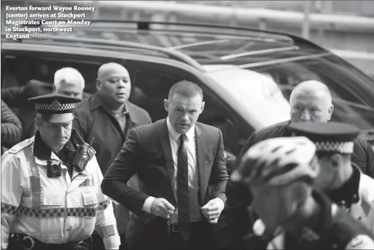  ??  ?? Everton forward Wayne Rooney (center) arrives at Stockport Magistrate­s Court on Monday in Stockport, northwest England.