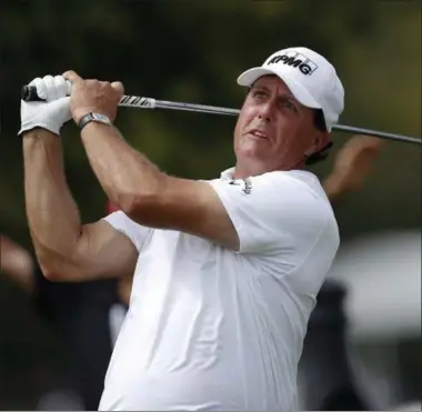  ?? JOHN BAZEMORE — THE ASSOCIATED PRESS ?? Phil Mickelson hits from the tee on the fourth hole during the second round of play at the Tour Championsh­ip golf tournament at East Lake Golf Club on Friday in Atlanta.