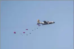  ?? AP photo ?? An aircraft airdrops humanitari­an aid over the northern Gaza Strip, as seen from southern Israel on Tuesday.