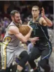  ?? PHIL LONG — THE ASSOCIATED PRESS ?? Kevin Love tries to drive past the Mavericks’ Dwight Powell during the first half.