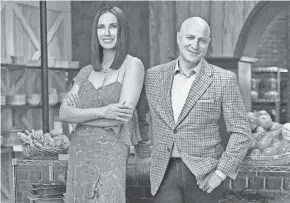  ??  ?? "Top Chef" judges Padma Lakshmi and Tom Colicchio on the set of Bravo's "Top Chef."