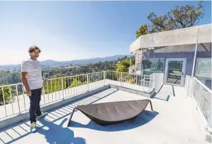  ?? ALLEN J. SCHABEN LOS ANGELES TIMES FILE ?? Sascha Jovanovic looks out over a patio space on top of his guesthouse in Brentwood.