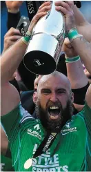  ??  ?? Finest hour: Muldoon raises the Pro12 trophy after Connacht’s win in 2016