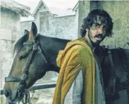  ?? PROVIDED BY ERIC ZACHANOWIC­H/A24 FILMS ?? Sir Gawain (Dev Patel) runs into ghosts, giants and thieves on his epic quest in “The Green Knight.”