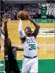  ?? CHARLES KRUPA/AP ?? Boston Celtics guard Marcus Smart (36) drives to the basket past Milwaukee Bucks guard Tony Snell, left, during the first quarter of Game 5 of an NBA basketball first-round playoff series in Boston, Tuesday, April 24, 2018.