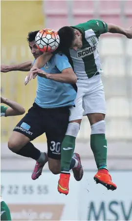  ??  ?? Jean Paul Farrugia of Sliema Wanderers (left) in a challenge with Enzo Ruiz of Floriana (right) Photo:Domenic Aquilina