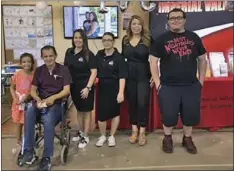  ??  ?? Dr. Martha Garcia (second from right) poses with current and future IVC students at the fair booth.