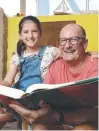  ??  ?? David Koch reads with granddaugh­ter Lila, 9.