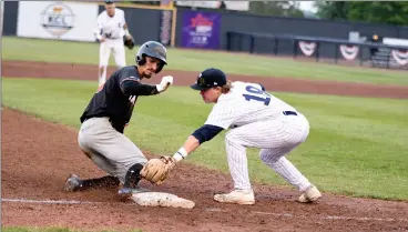  ?? HERALD PHOTO BY JUSTIN SEWARD ?? Lethbridge Bulls Cardel Dick attempts to tag out Fort McMurray Giants’ Bryson Collins during Western Canadian Baseball League action at Spitz Stadium on Thursday.