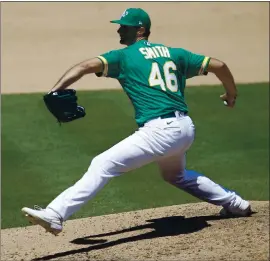  ?? JANE TYSKA — STAFF PHOTOGRAPH­ER ?? Athletics relief pitcher Burch Smith threw two shutout innings against the Angels on Monday and now is Major League Baseball’s wins leader with two.