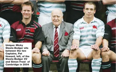  ??  ?? Unique: Micky Steele-Bodger sits between the two Captains, Pat Howard, left, of the Steele-Bodger XV and Simon Frost of Cambridge in 2004