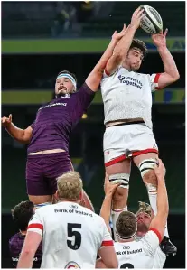  ??  ?? DOWN YOU GO: Jacob Stockdale is tackled by Rory O’Loughlin (right) and (above) Sam Carter wins possession in a line out under pressure from Max Deegan