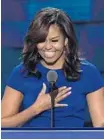  ?? SAUL LOEB/AFP/GETTY IMAGES ?? First lady Michelle Obama gestures during an address to the delegates Monday night.