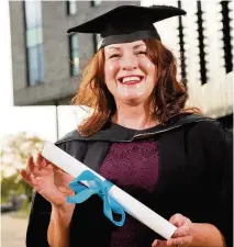  ??  ?? Deborah Howard, from Oswaldtwis­tle, with her degree from the University Centre at Blackburn College