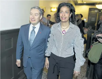  ?? GRAHAM HUGHES/ THE CANADIAN PRESS ?? Minister of Internatio­nal Trade Francois- Philippe Champagne, left, and Quebec’s Minister of the Economy, Science and Innovation Dominique Anglade arrive for NAFTA talks in Montreal on Monday.