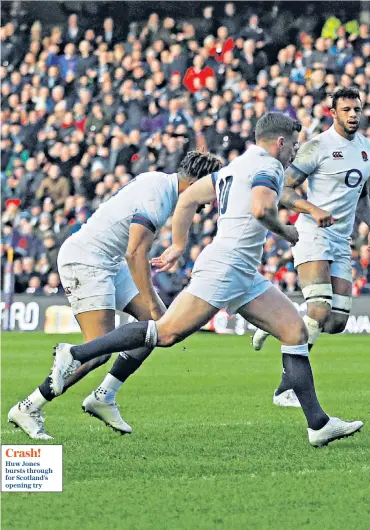  ??  ?? Crash! Huw Jones bursts through for Scotland’s opening try