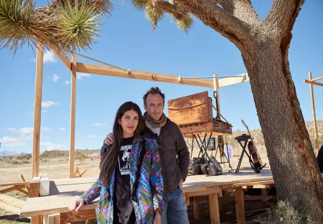  ?? ?? Jacqueline Herrera and her husband, Jeremie Levi Samson, the owners of the Mon Petit Mojave ranch, where they host drive- in concerts, in Joshua Tree, Calif., in March. The use of their private road by guests from a nearby glamping site led to a lawsuit.
