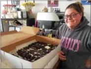  ?? EVAN BRANDT — DIGITAL FIRST MEDIA ?? Kristen Sirbak, owner of Beverly’s Pastry, got up at 4:30 a.m. Friday to finish a batch of 500 chocolates to be given out during the YMCA’s Halloween Safehouse that night. The project was arranged by The Hill School for PottstownC­ARES Day.