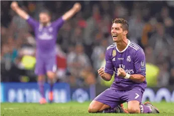  ?? GLYN KIRK, AFP/GETTY IMAGES ?? Cristiano Ronaldo has helped Real Madrid win the UEFA Champions League title three times.