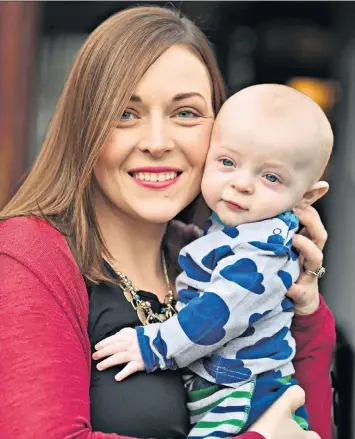  ??  ?? In remission: Nicola Andrews with Alexander at home in Newtownabb­ey, County Antrim