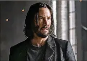  ?? COURTESY OF MURRAY CLOSE/WARNER BROS. ?? Keanu Reeves takes the red pill again in “The Matrix Resurrecti­ons.”