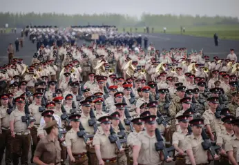  ?? Getty ?? Troops from Commonweal­th countries on the rehearsal march at RAF Odiham on Sunday