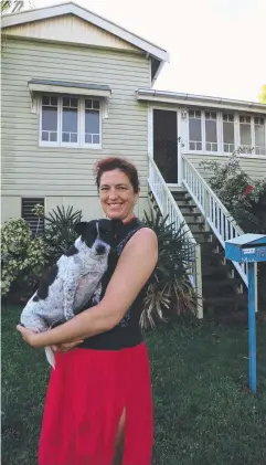  ??  ?? SOUGHT-AFTER SUBURB: Bungalow resident Ruby Bousard and her dog Napoleon outside her Edgar St home. Picture: STEWART McLEAN