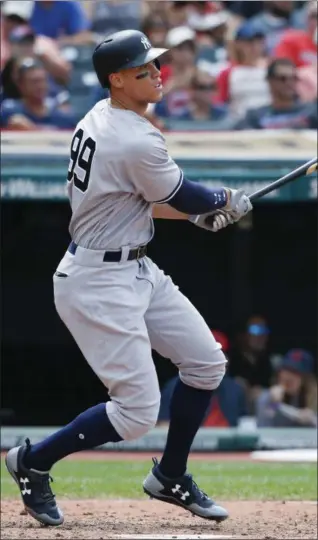  ?? RON SCHWANE — ASSOCIATED PRESS ?? Yankees’ Aaron Judge follows the flight of his three-run homer in the seventh inning of Sunday’s game at Cleveland.