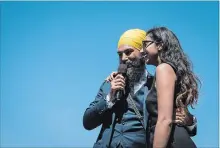  ?? DARRYL DYCK THE CANADIAN PRESS ?? NDP Leader Jagmeet Singh stands with his wife, Gurkiran Kaur Sidhu, after announcing he will run in a byelection in Burnaby South.