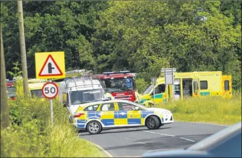  ??  ?? Emergency services at the scene of the accident on the A28 near Shadoxhurs­t