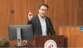  ?? SOUTH FLORIDA SUN SENTINEL FILE ?? City Manager Greg Chavarria on April 19, 2023 explains why the commission chambers were reopened that night to hold a planning board meeting. He said it likely would be the last public meeting ever held at City Hall.