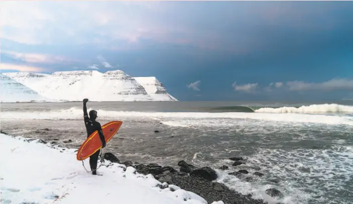  ?? Chris Burkard MASSIF ?? Not all surfing happens on balmy beaches, as illustrate­d by “Under an Arctic Sky,” a 2017 documentar­y that showcases surfing in Iceland’s Westfjords.