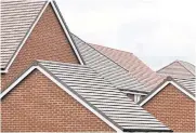  ?? BLOOMBERG ?? Roofs of completed houses at a residentia­l housing constructi­on site in Hoo, UK.